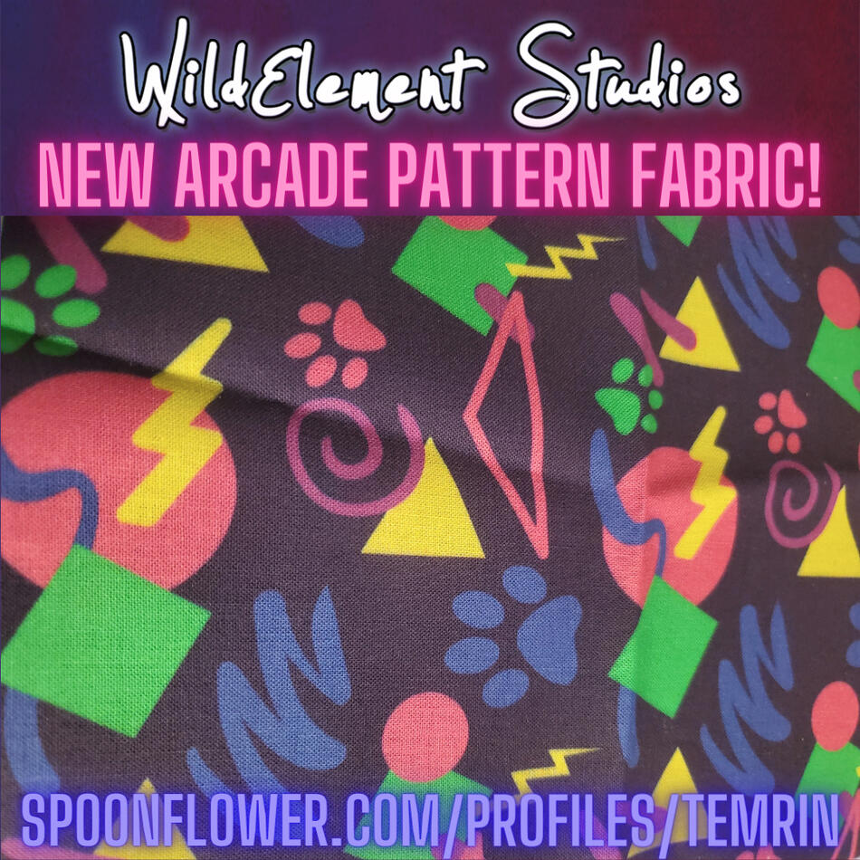 a photo pf fabric that has an arcade themed pattern design on it with brightly coloured shapes and paw pads on it.